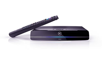 TV remote resting on tv box