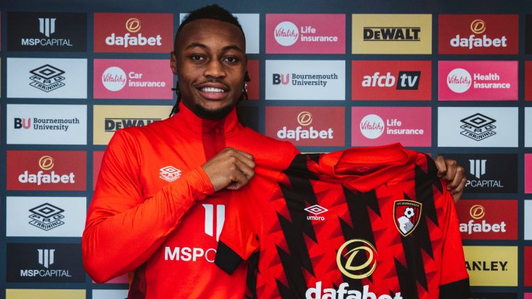 Antoine Semenyo poses with Bournemouth's home shirt after signing