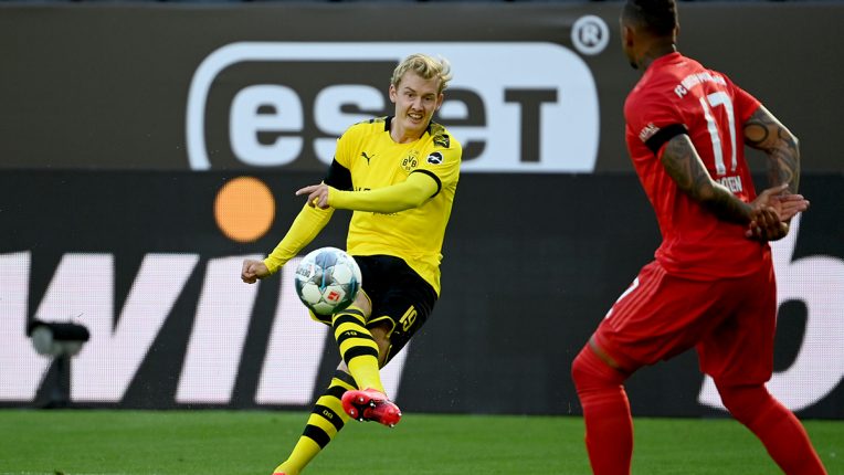 Julian Brandt fires a shot on goal as Borussia Dortmund face Bayern Munich in the Bundesliga