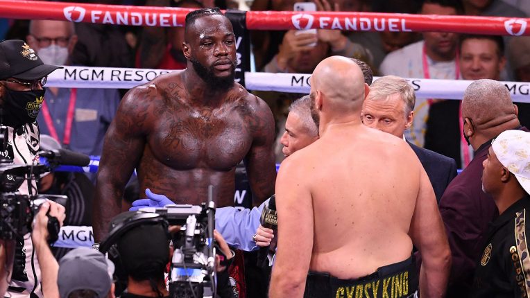Tyson Fury facing off with Deontay Wilder in the third press conference