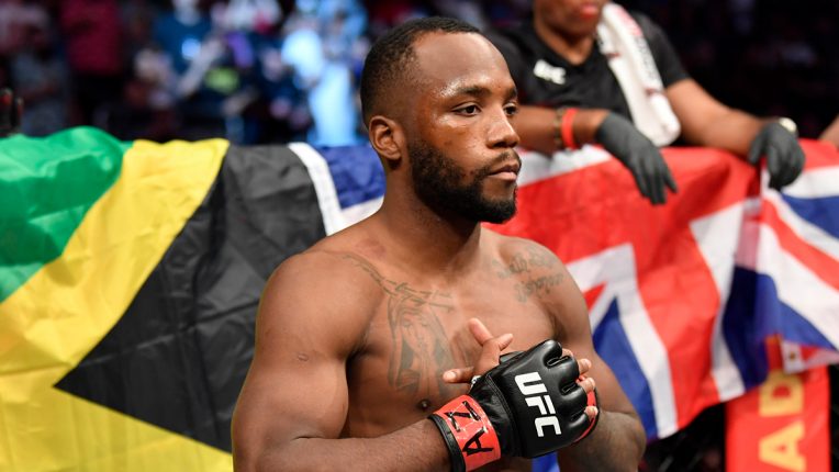 Leon Edwards standing in front of the Jamaican and English flags