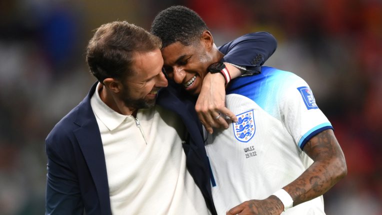 Marcus Rashford is congratulated by Gareth Southgate after coming off following his two goals against Wales