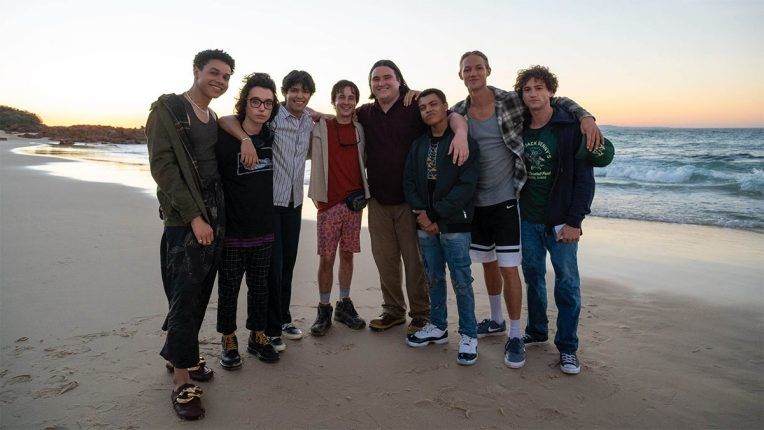 The new male cast of The Wilds season 2 on a beach