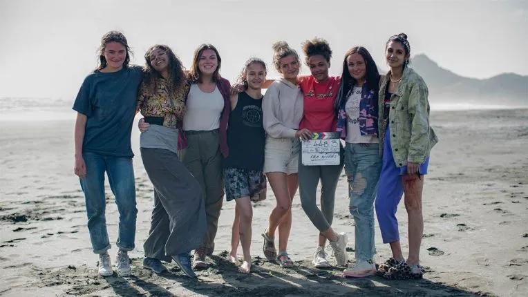 The female cast of The Wilds on a beach