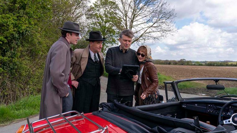 Matthew Beard, Tim McMullan, Peter Cattaneo and Lesley Manville on the set of Magpie Murders. 