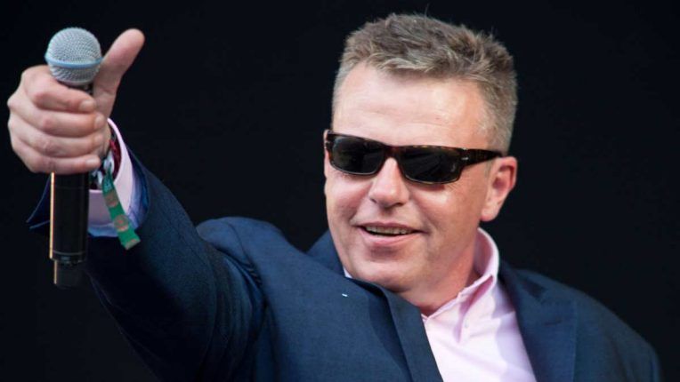 Suggs performing live with Madness