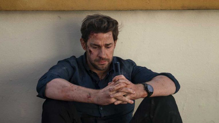 John Krasinski's Jack Ryan sat on the floor covered in cuts and bruises after an explosion