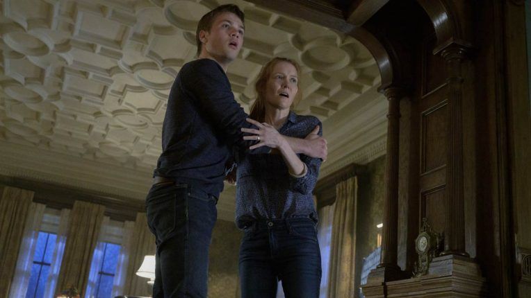 Connor Jessup and Darby Stanchfield are terrified in Locke and Key as Tyler and Nina
