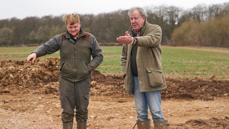 Jeremy Clarkson with his farming colleague Kaleb looking at their land