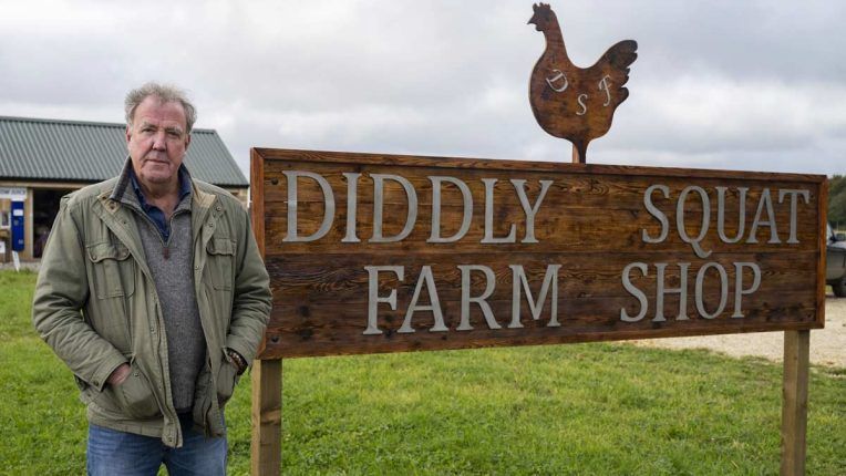 Jeremy Clarkson standing outside his Diddly Squat Farm Shop