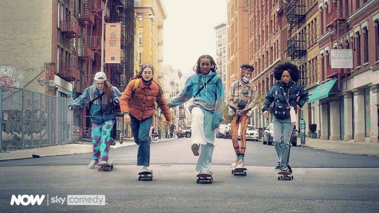The Betty cast members on skateboards on a road in New York