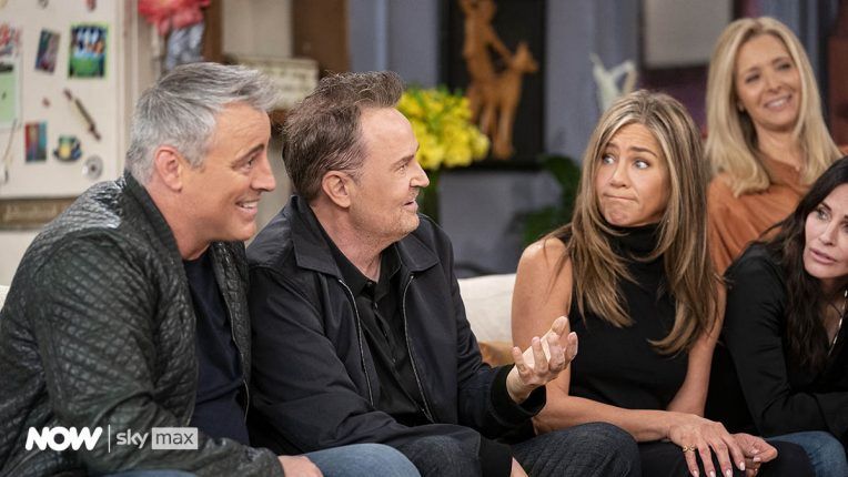 Matt LeBlanc, Matthew Perry, Jennifer Aniston and Lisa Kudrow playing a game and laughing in the Friends reunion special